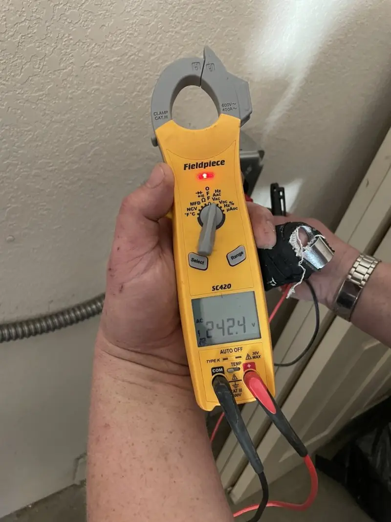 Voltage testing with clamp meter during Ceiling Fan Installation in Sleepy Eye